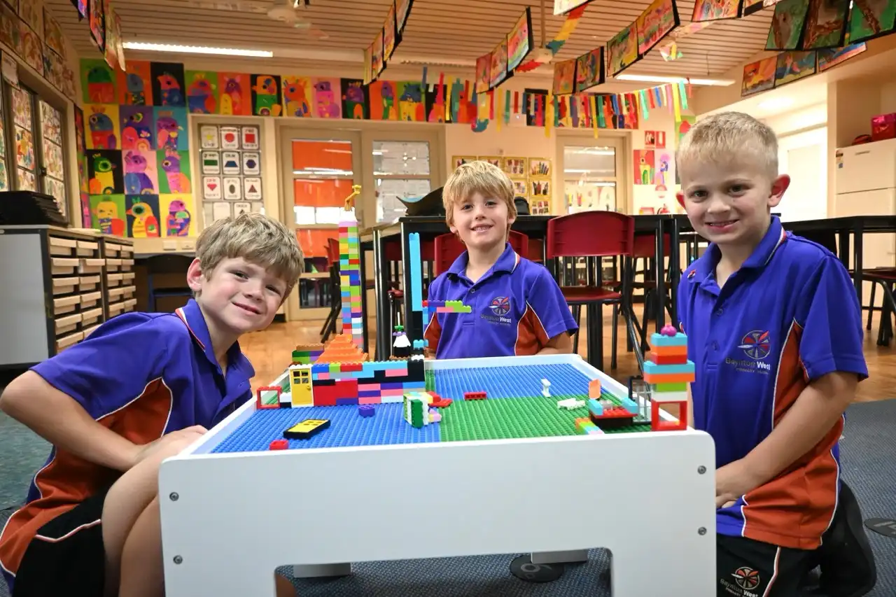 Three students at a lego board